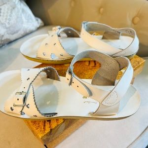 White Salltwater Sub San sandals with heart detail. In good shape!